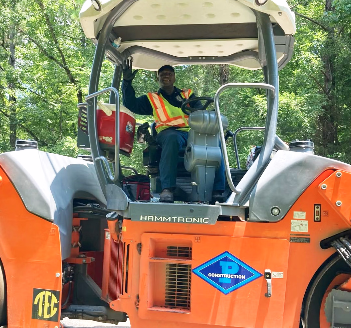 pittman employee on asphalt paving machine